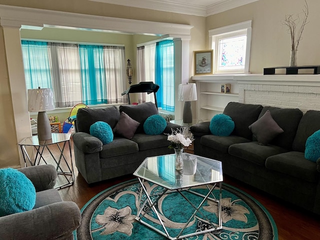 living room featuring ornamental molding and wood finished floors