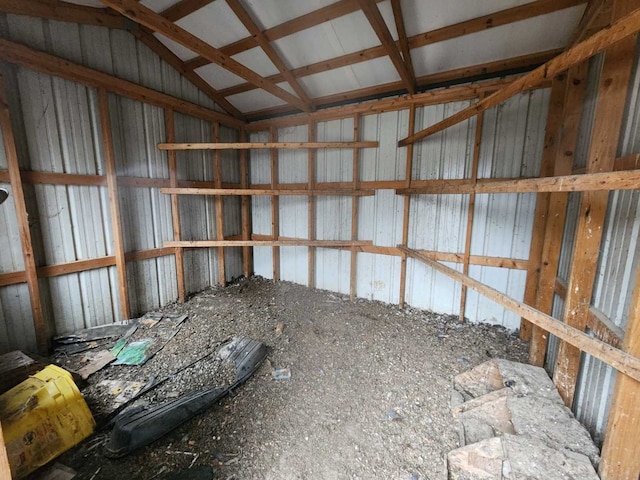 miscellaneous room with metal wall and vaulted ceiling