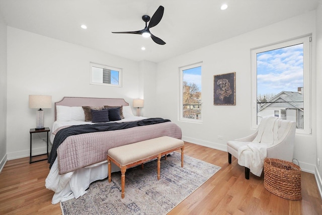 bedroom with recessed lighting, baseboards, light wood finished floors, and ceiling fan