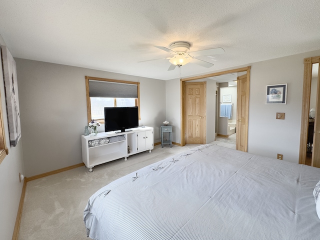 bedroom with a textured ceiling, ceiling fan, baseboards, and light colored carpet