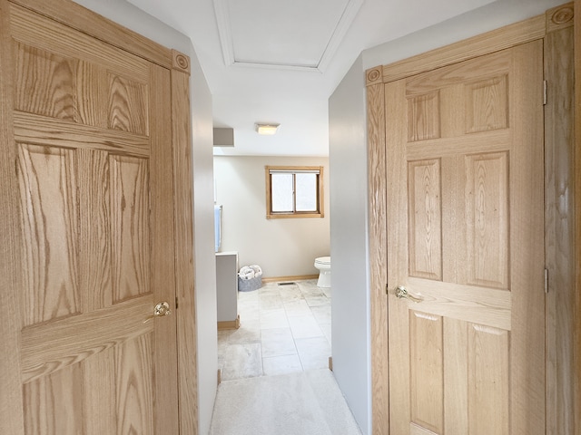 bathroom featuring toilet and baseboards