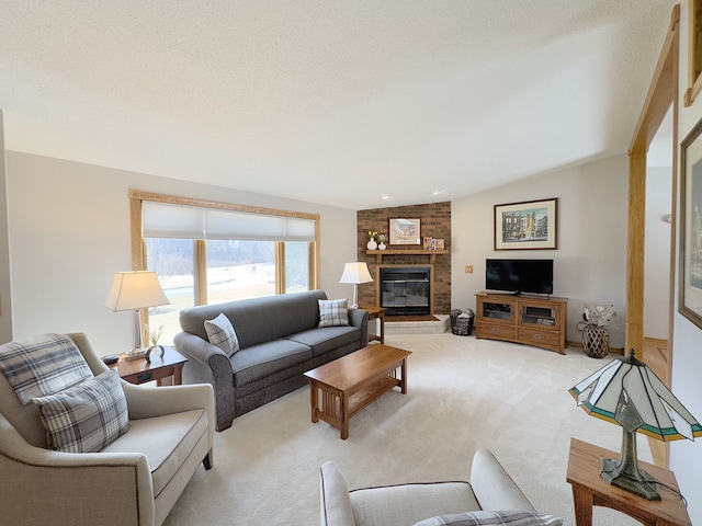 living room with a textured ceiling, a brick fireplace, and light colored carpet