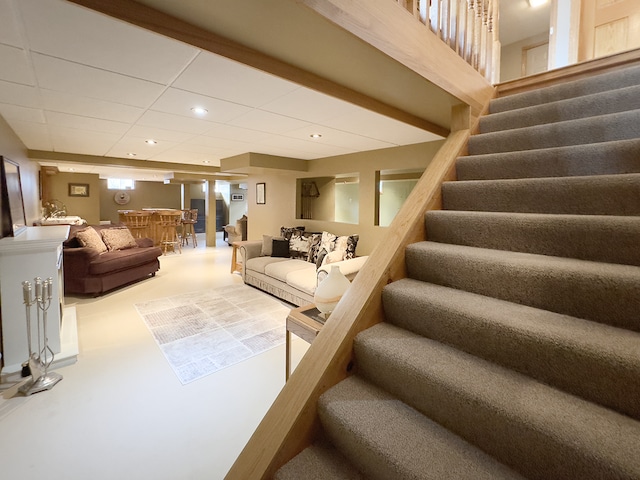 interior space featuring stairs, a paneled ceiling, and recessed lighting