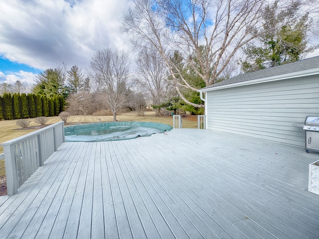 wooden deck with a covered pool