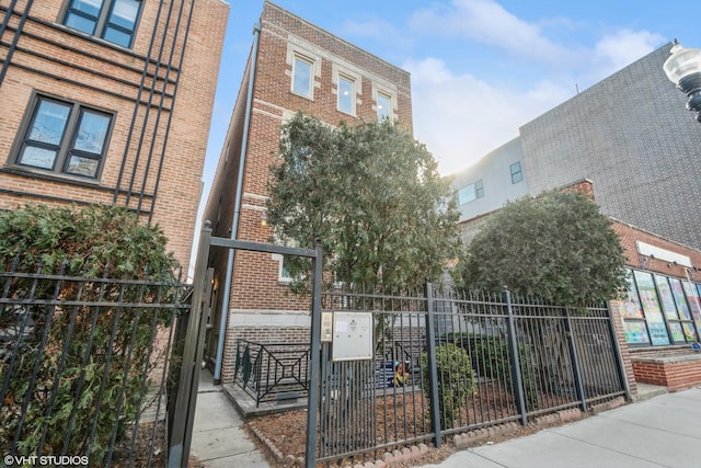 view of gate featuring fence