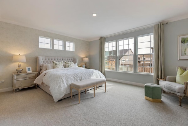 bedroom with baseboards, multiple windows, ornamental molding, and carpet flooring