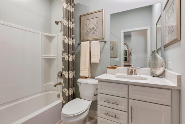 bathroom with shower / bath combination, vanity, and toilet