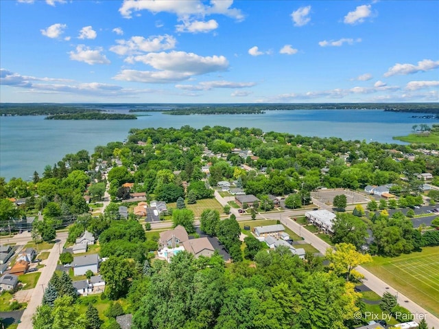 bird's eye view featuring a water view and a residential view