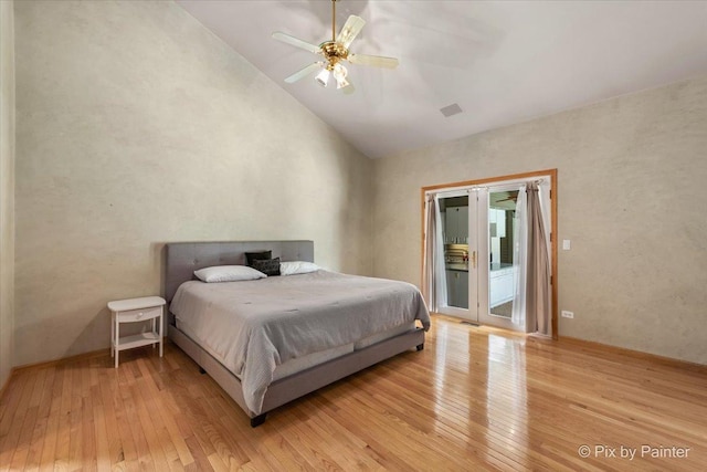 bedroom featuring access to exterior, high vaulted ceiling, light wood finished floors, and a ceiling fan