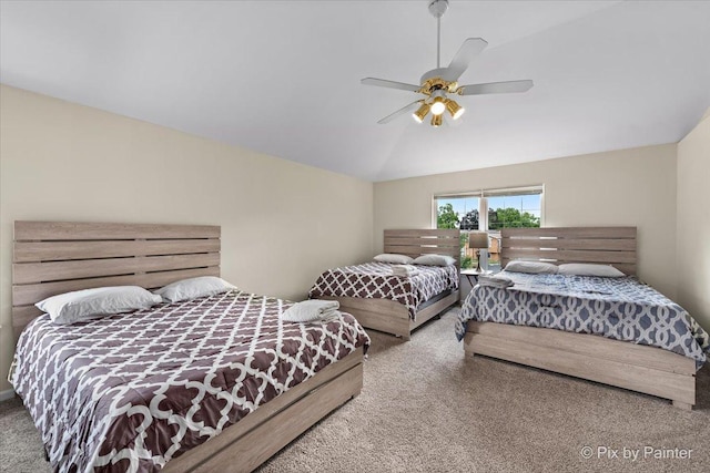 carpeted bedroom with lofted ceiling and a ceiling fan