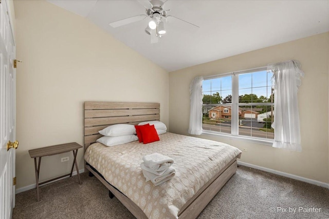 bedroom featuring vaulted ceiling, ceiling fan, carpet, and baseboards