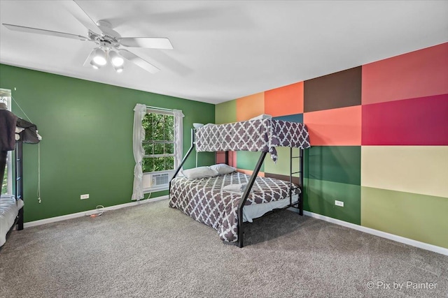 carpeted bedroom featuring ceiling fan, baseboards, and cooling unit