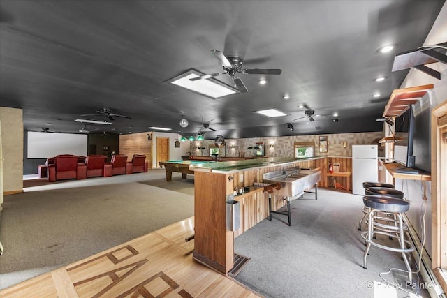 kitchen featuring a ceiling fan, freestanding refrigerator, light colored carpet, and billiards