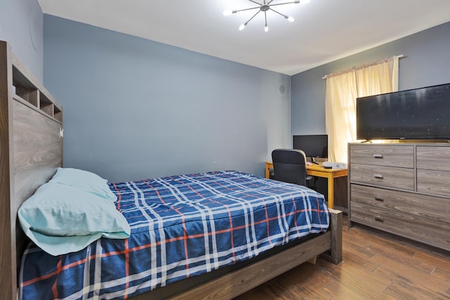 bedroom with wood finished floors