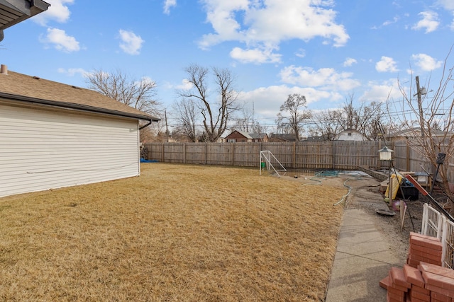 view of yard with a fenced backyard