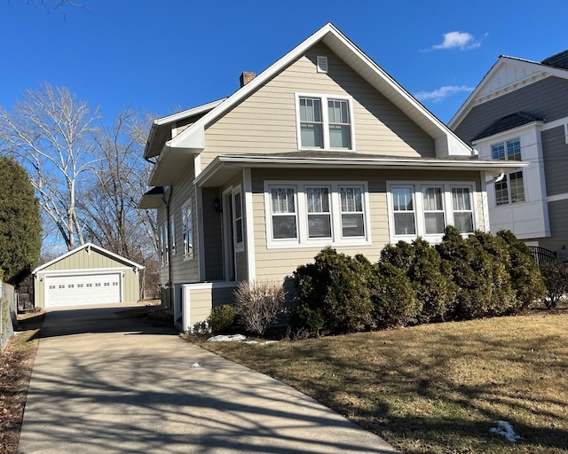 view of front of home with an outbuilding and a garage