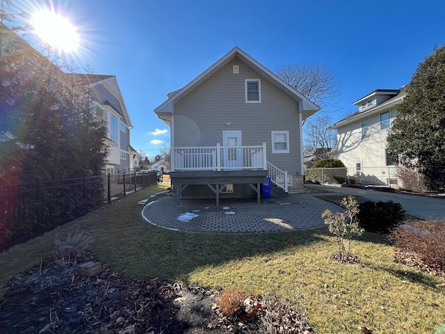 back of house with stairs, a yard, a patio, and fence