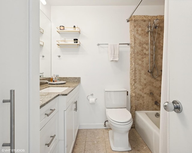 full bath with tile patterned floors, toilet, vanity, tub / shower combination, and baseboards