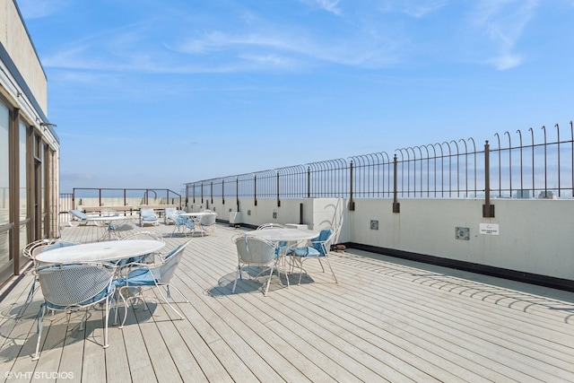 5455 N Sheridan Rd Unit 1006, Chicago, IL 60640 - wooden deck featuring outdoor dining area and a water view