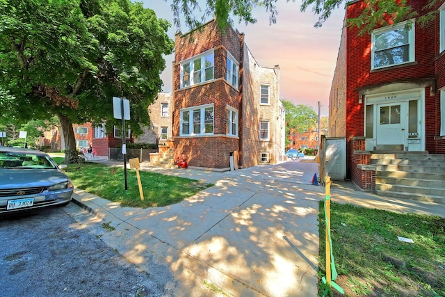 view of front of house with brick siding