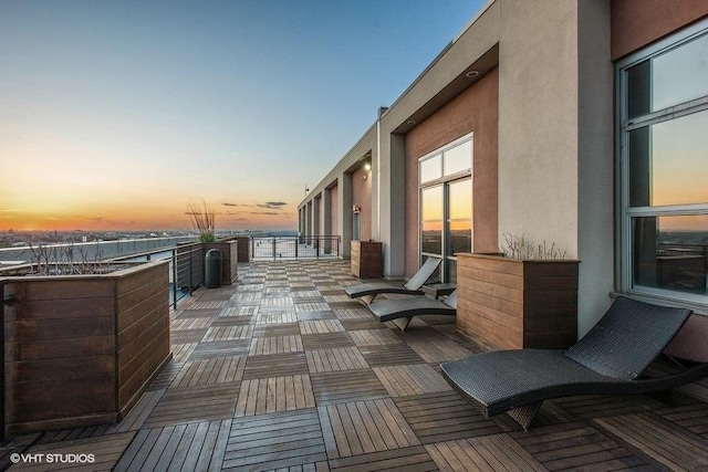 patio terrace at dusk with a balcony