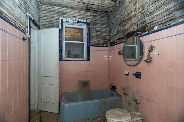 3827 W Gladys Ave, Chicago, IL 60624 - bathroom with a bathtub, tile walls, and toilet