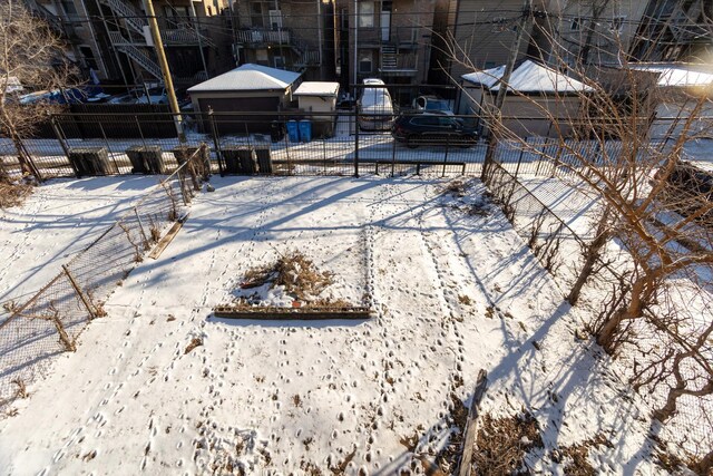 3827 W Gladys Ave, Chicago, IL 60624 - yard layered in snow with fence