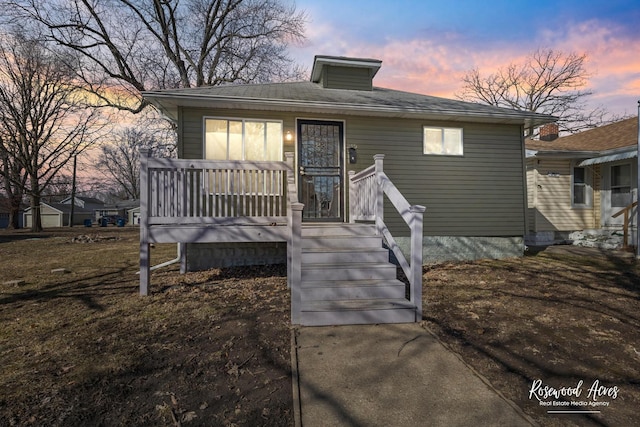 view of front of home featuring a wooden deck