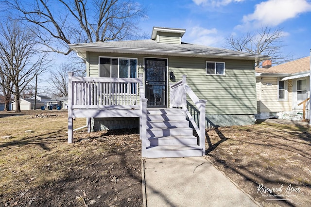 view of front facade featuring a wooden deck