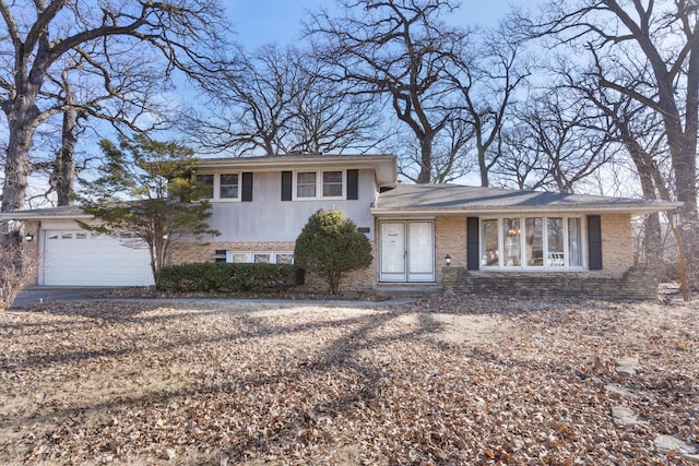 split level home featuring brick siding