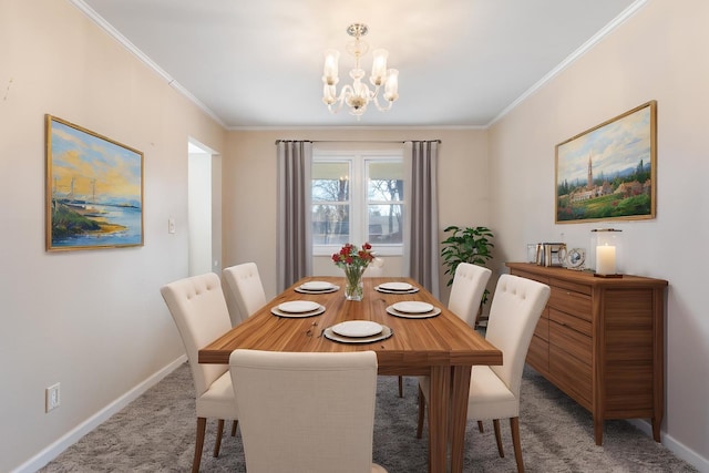 dining room with a chandelier, ornamental molding, light carpet, and baseboards