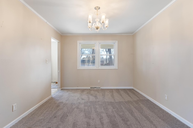 spare room with visible vents, crown molding, baseboards, and an inviting chandelier