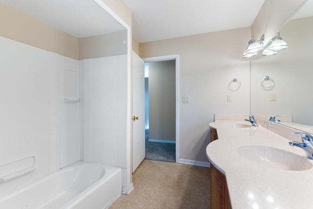 bathroom with double vanity, shower / tub combination, baseboards, and a sink