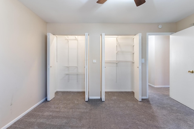 unfurnished bedroom with a ceiling fan, carpet flooring, and baseboards