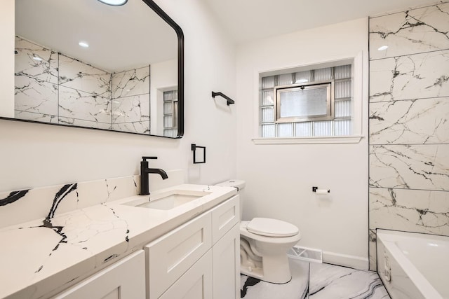 bathroom with marble finish floor, visible vents, toilet, vanity, and baseboards