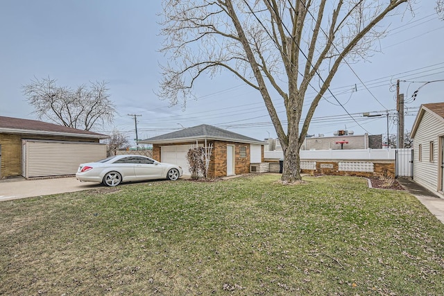 exterior space featuring fence, a front lawn, and an outdoor structure