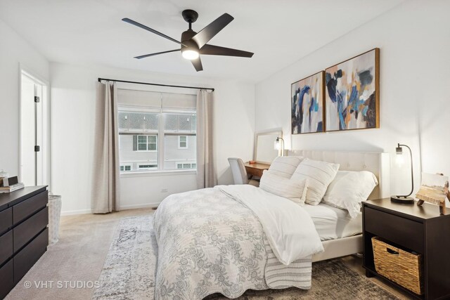 bedroom with carpet floors, baseboards, and a ceiling fan