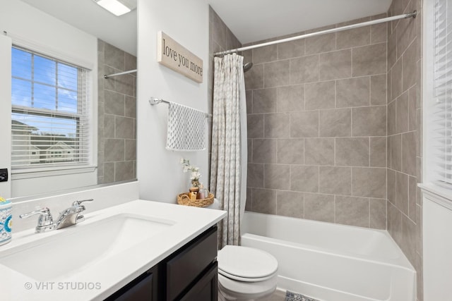 bathroom with shower / bath combination with curtain, vanity, and toilet