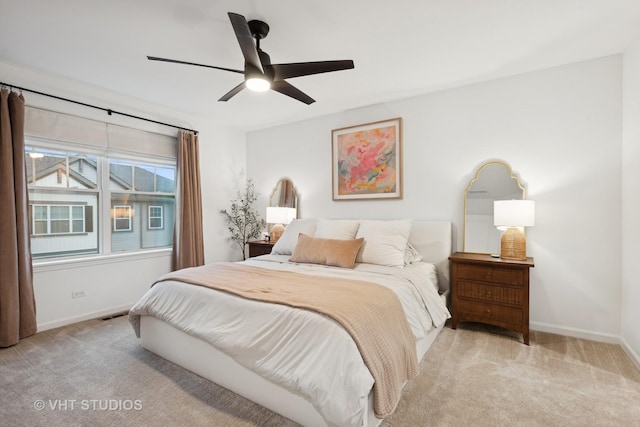 bedroom featuring carpet flooring, ceiling fan, visible vents, and baseboards