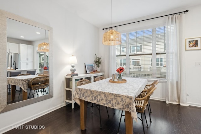 dining room featuring recessed lighting, dark wood-style flooring, and baseboards