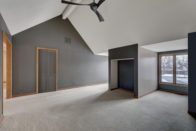 interior space with beam ceiling, visible vents, a ceiling fan, high vaulted ceiling, and baseboards