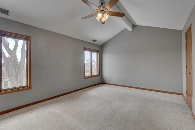 empty room featuring vaulted ceiling with beams, visible vents, and light colored carpet