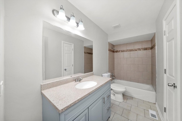 bathroom with shower / tub combination, toilet, tile patterned flooring, vanity, and visible vents