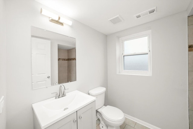 full bathroom with baseboards, visible vents, vanity, and toilet