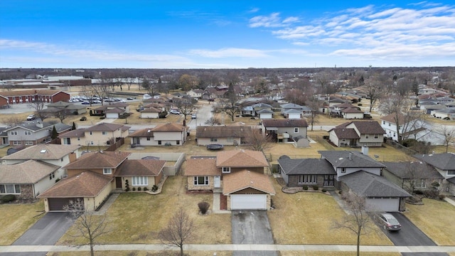 birds eye view of property with a residential view