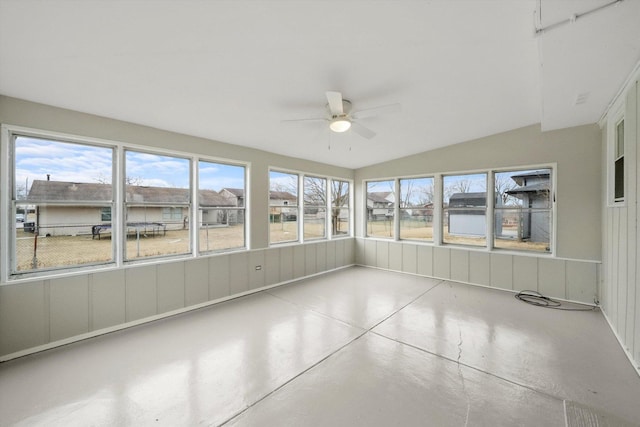 unfurnished sunroom featuring ceiling fan