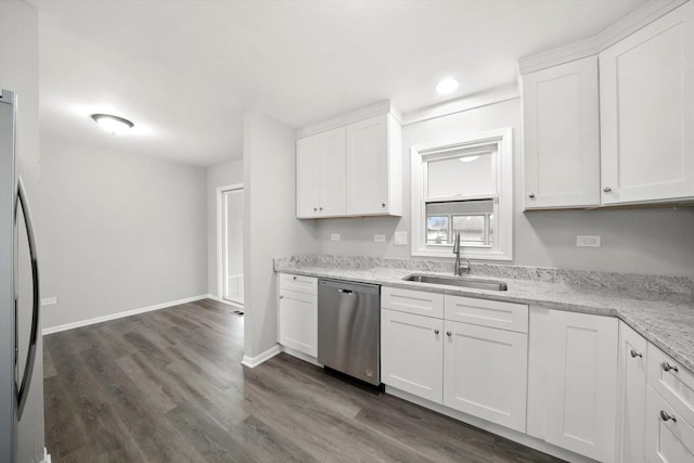 kitchen featuring stainless steel appliances, dark wood finished floors, white cabinets, and a sink