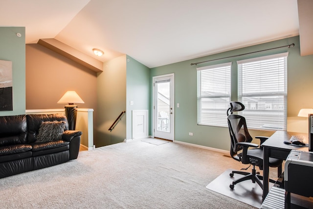 carpeted office with baseboards, vaulted ceiling, and a wealth of natural light