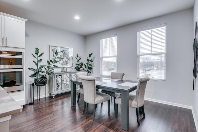 dining space with dark wood-style floors, recessed lighting, and baseboards