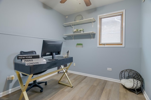 office space featuring baseboards and wood finished floors